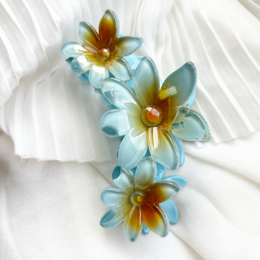 three tropical flowers haarclip blauw