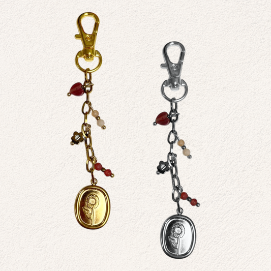 bag charm met bloem en roze bedels